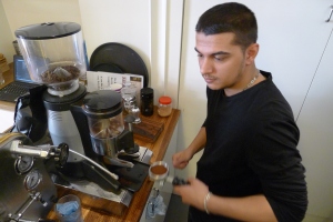 Patryk preparing coffee in cafe